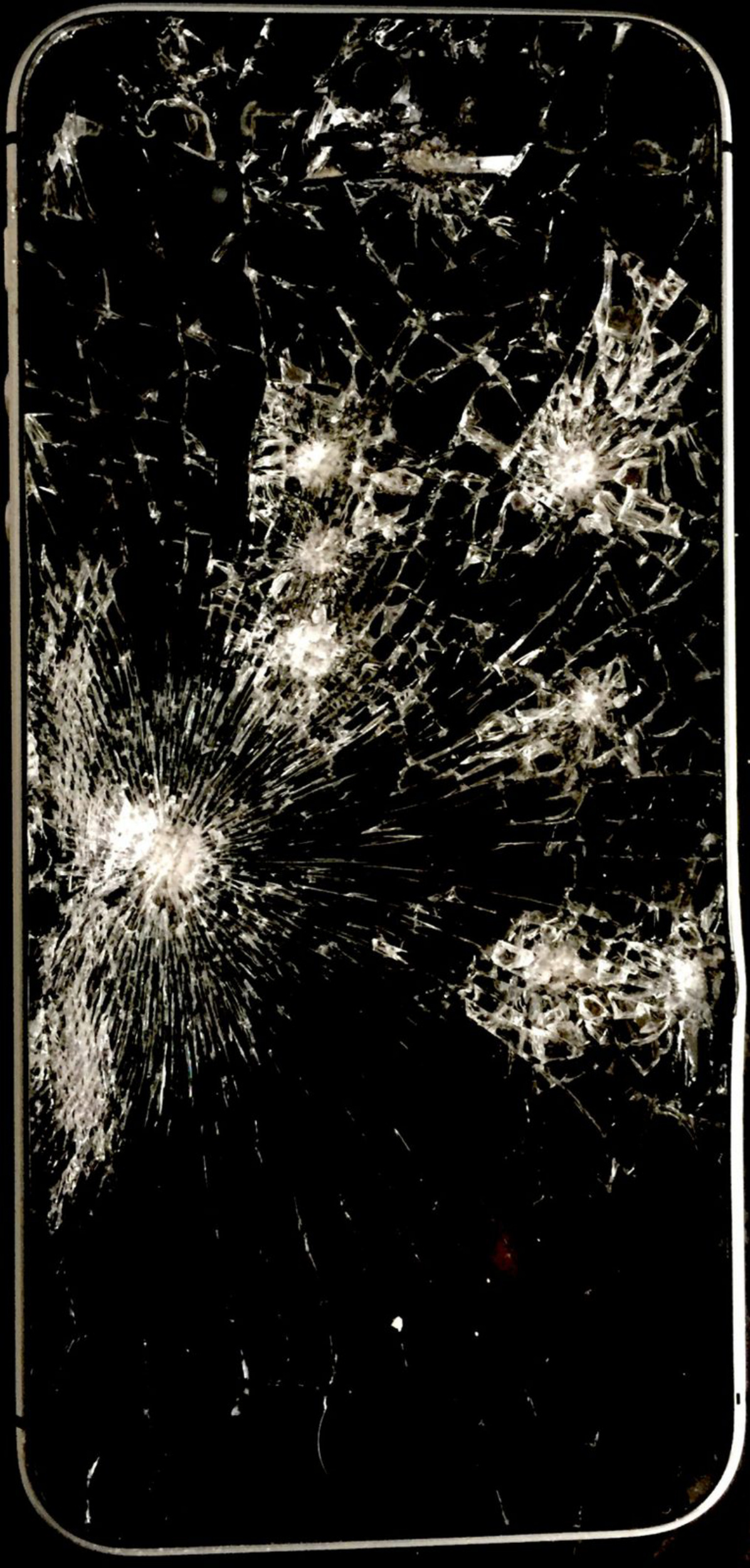 Steve's iPhone 4 — nine impact points from a knife sharpener, spider-web cracks radiating from each strike, each one a separate deliberate blow